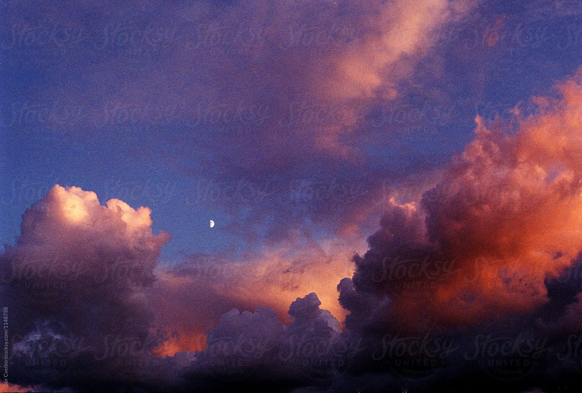 Moon in sunset clouds