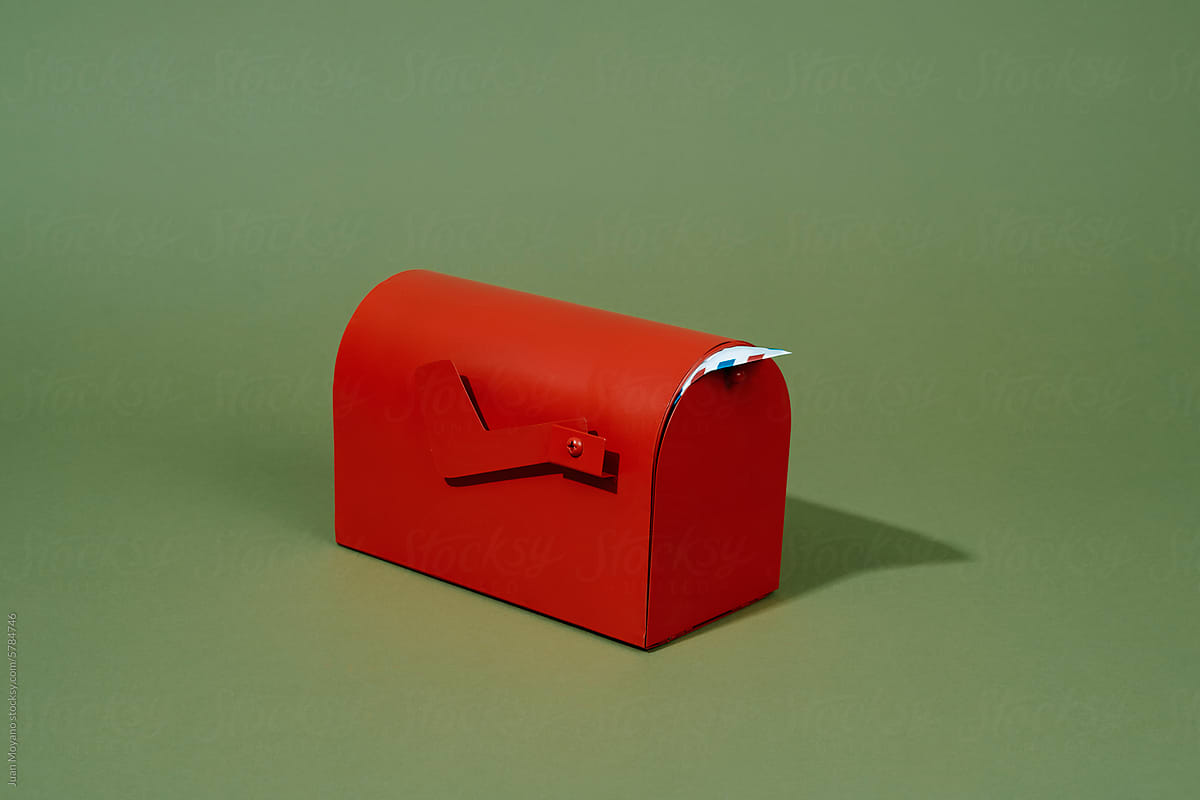red mailbox with an airmail letter