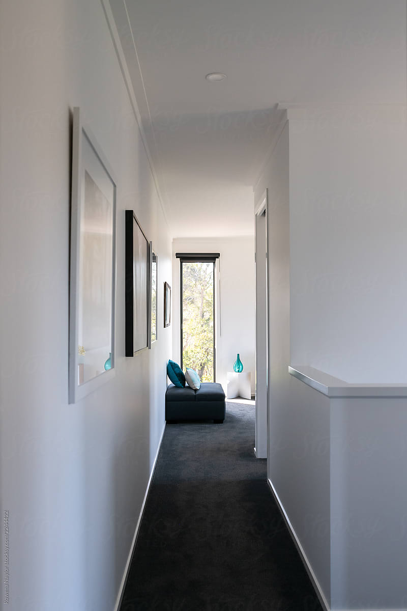 Hallway leading to small second level lounge room