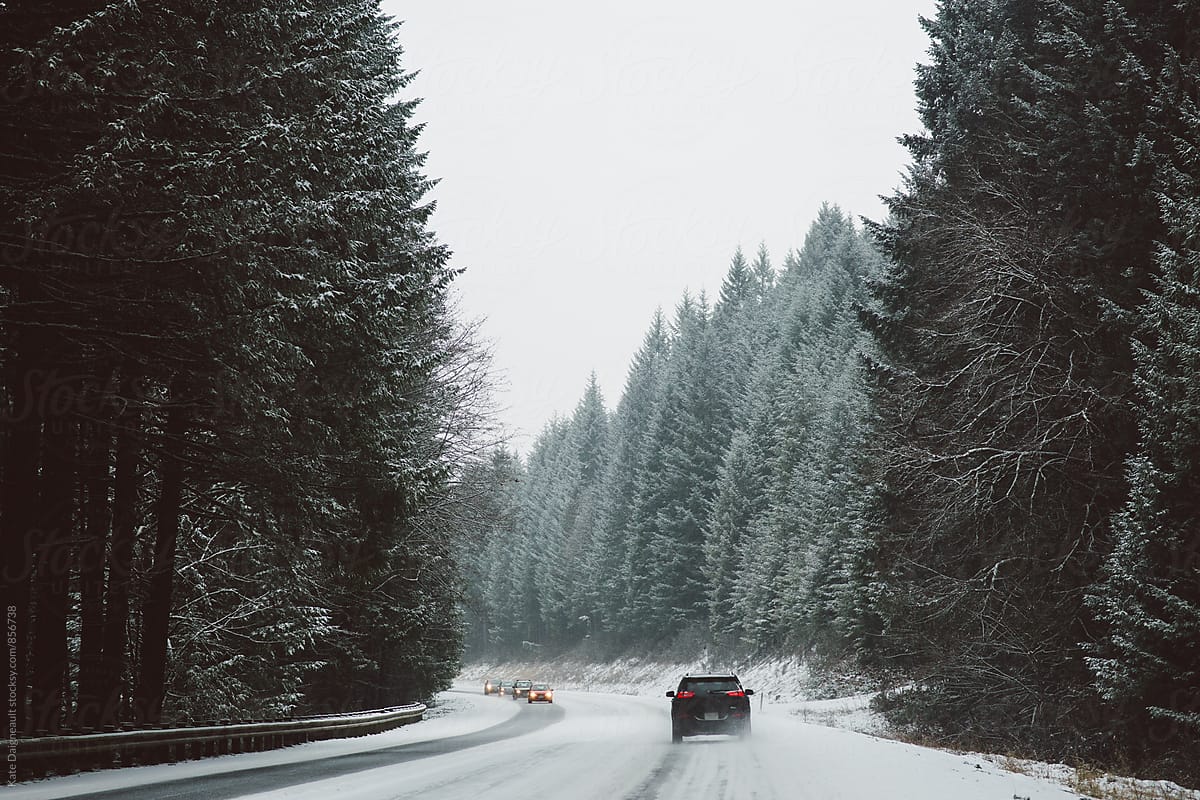 Drive through a snowy mountain pass.