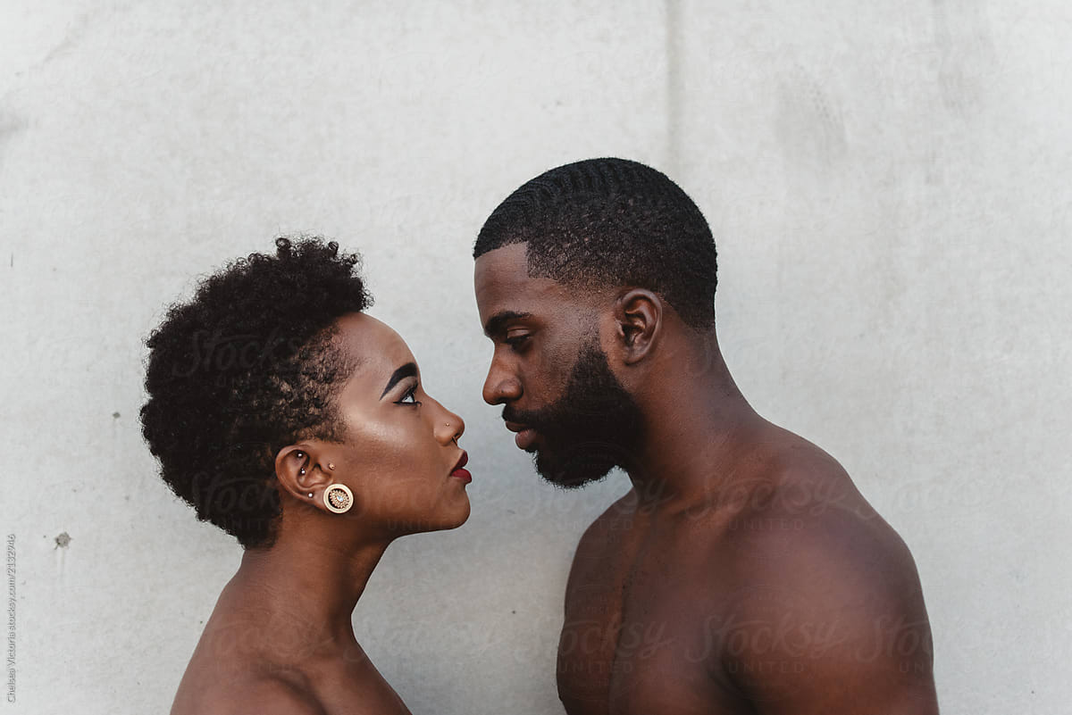 «A Young Black Couple Facing Each Other» del colaborador de Stocksy ...