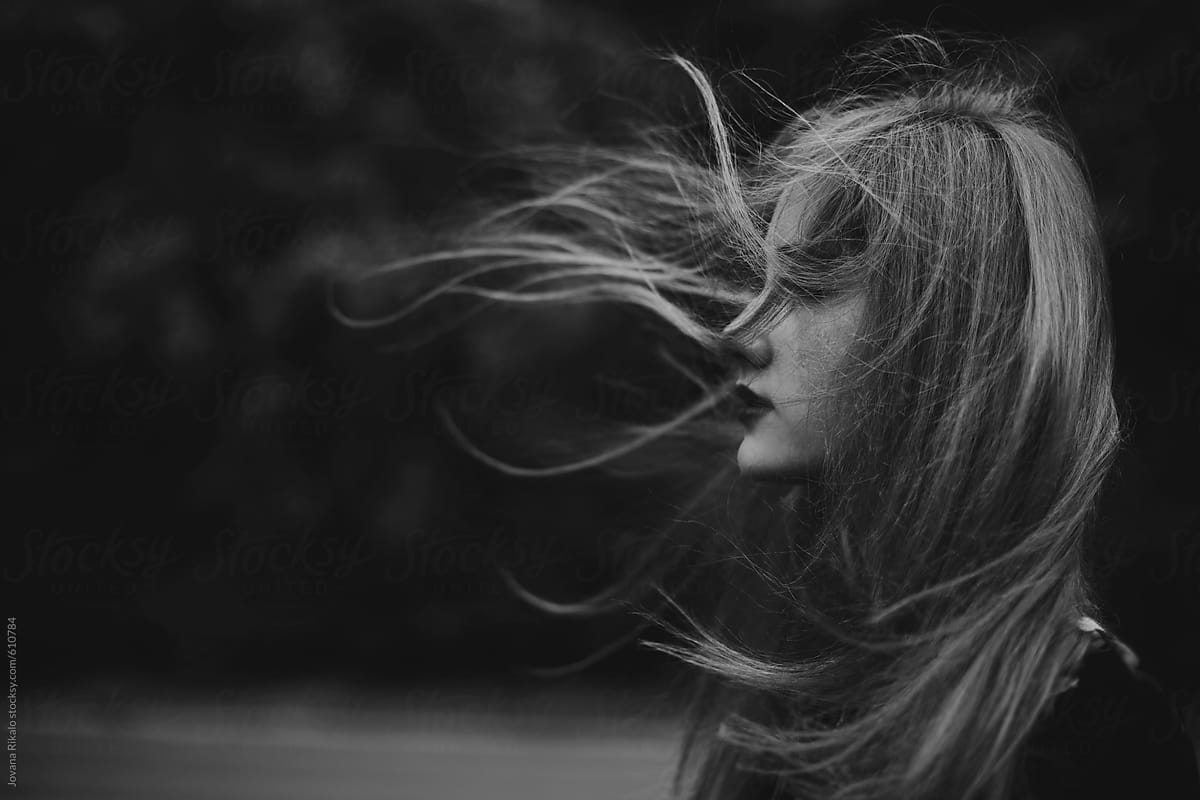 Girl With Hair Blowing In The Wind