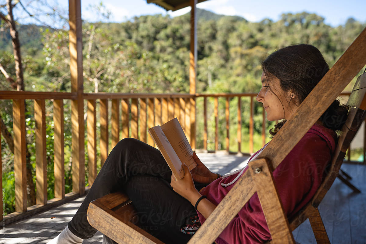 woman reading a book outdoors