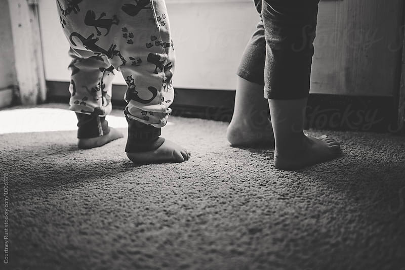 black and white image of toddler feet