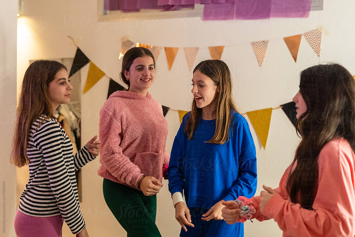 spontaneous moment of young girls in a pyjama party