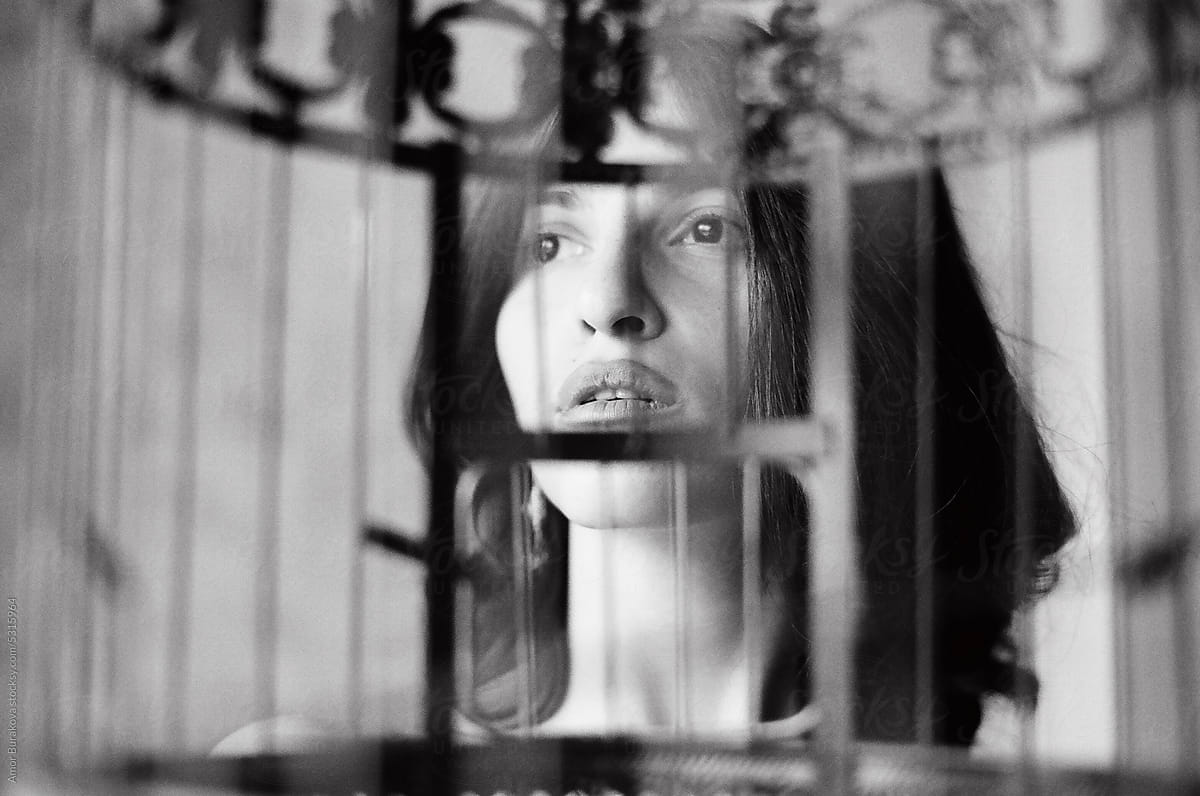 Woman looking through the cage