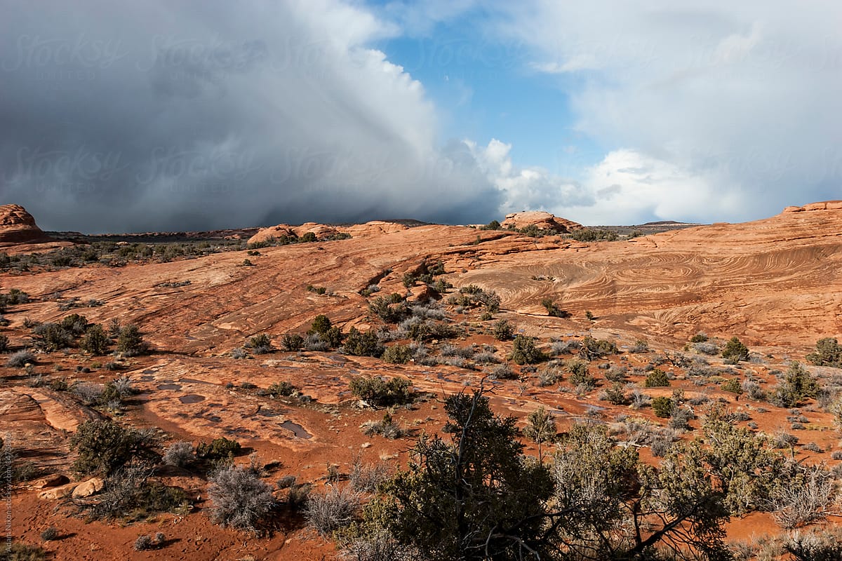 Approaching storm clouds over red rocks in Utah