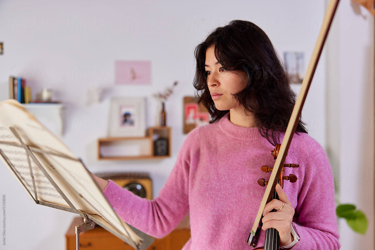 Female musician leafing through sheet music