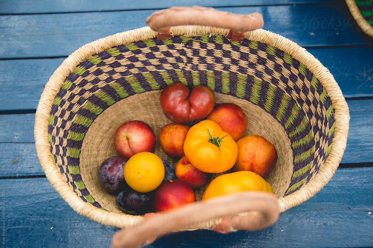 Bright colored fruit in woven basket