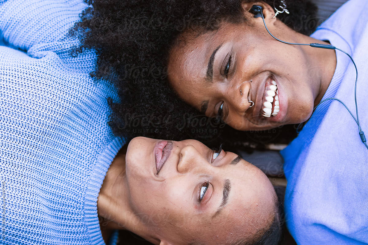 Happy Black Girlfriends Chilling And Listening To Music Together Del Colaborador De Stocksy 8861