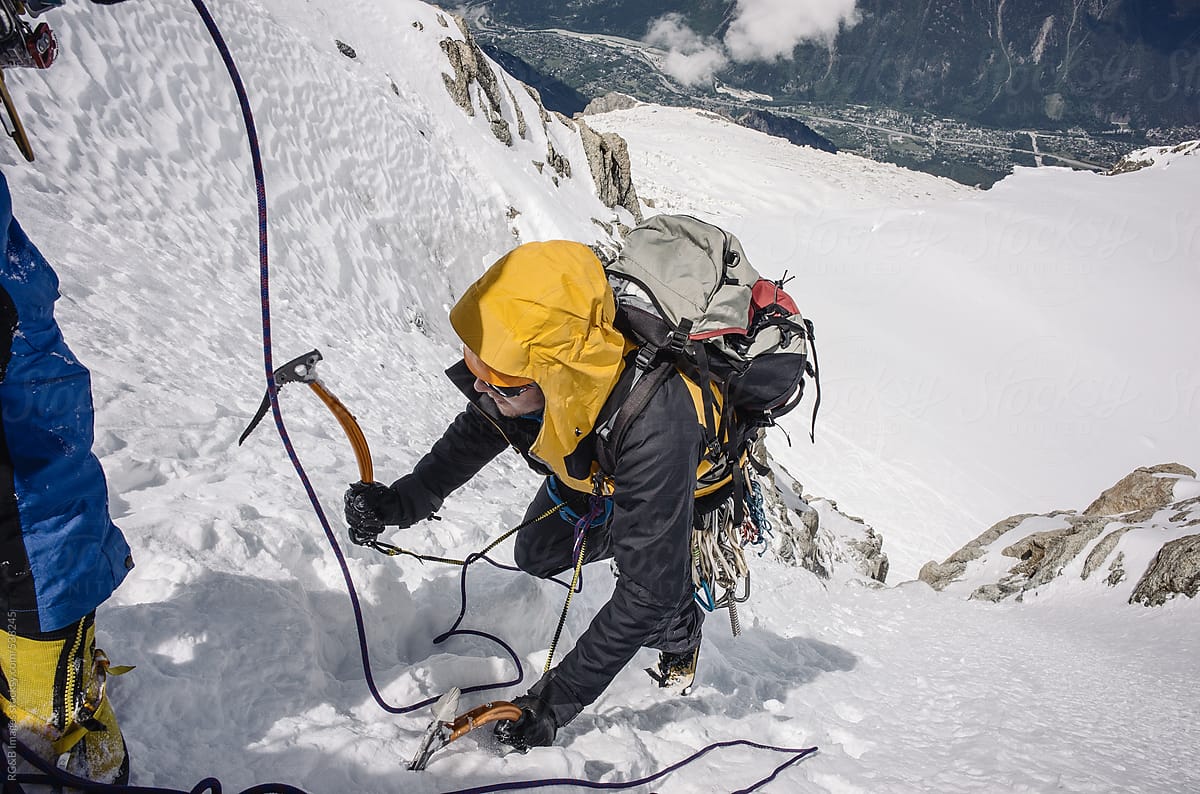 Man climbing steep ice