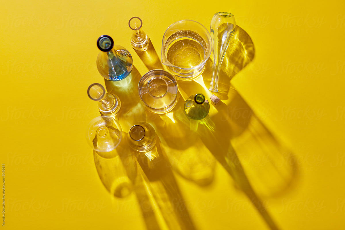 Top view of several glass bottles with cork, filled water and wi