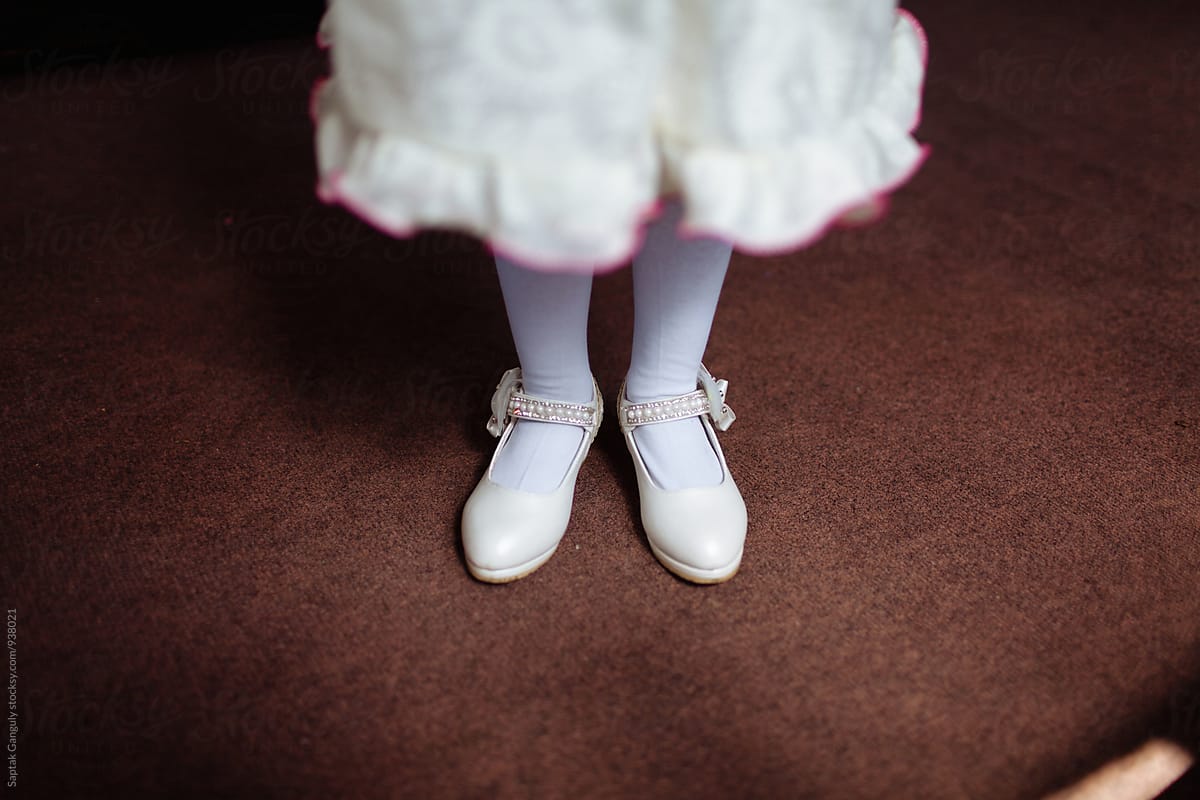 Little girl wearing stockings and pump shoe