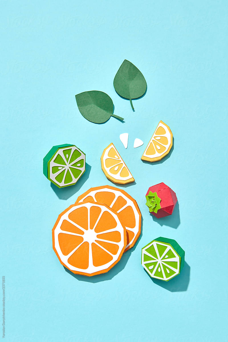 Handcraft paper composition of citrus fruits and srawberry