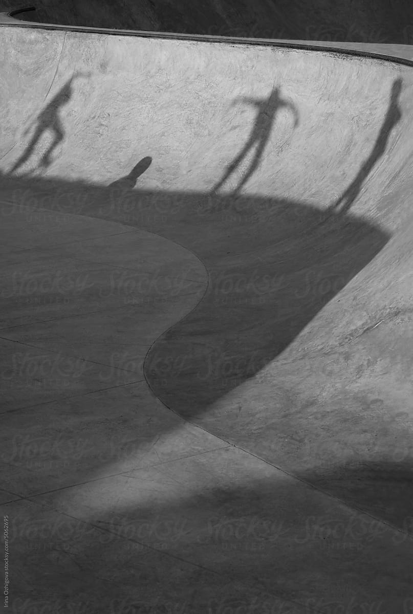 Shadows of a skateboarders