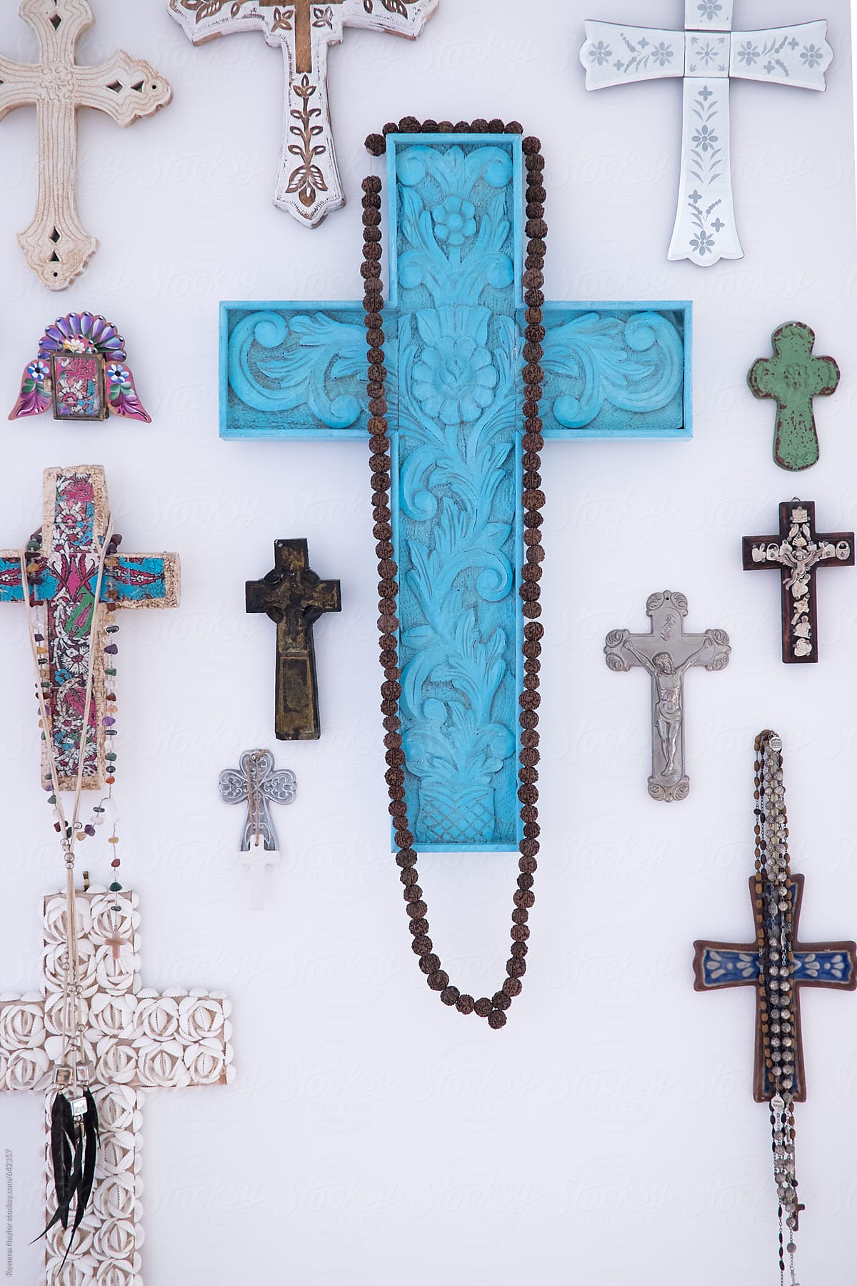 Collection of Catholic crosses hung on wall