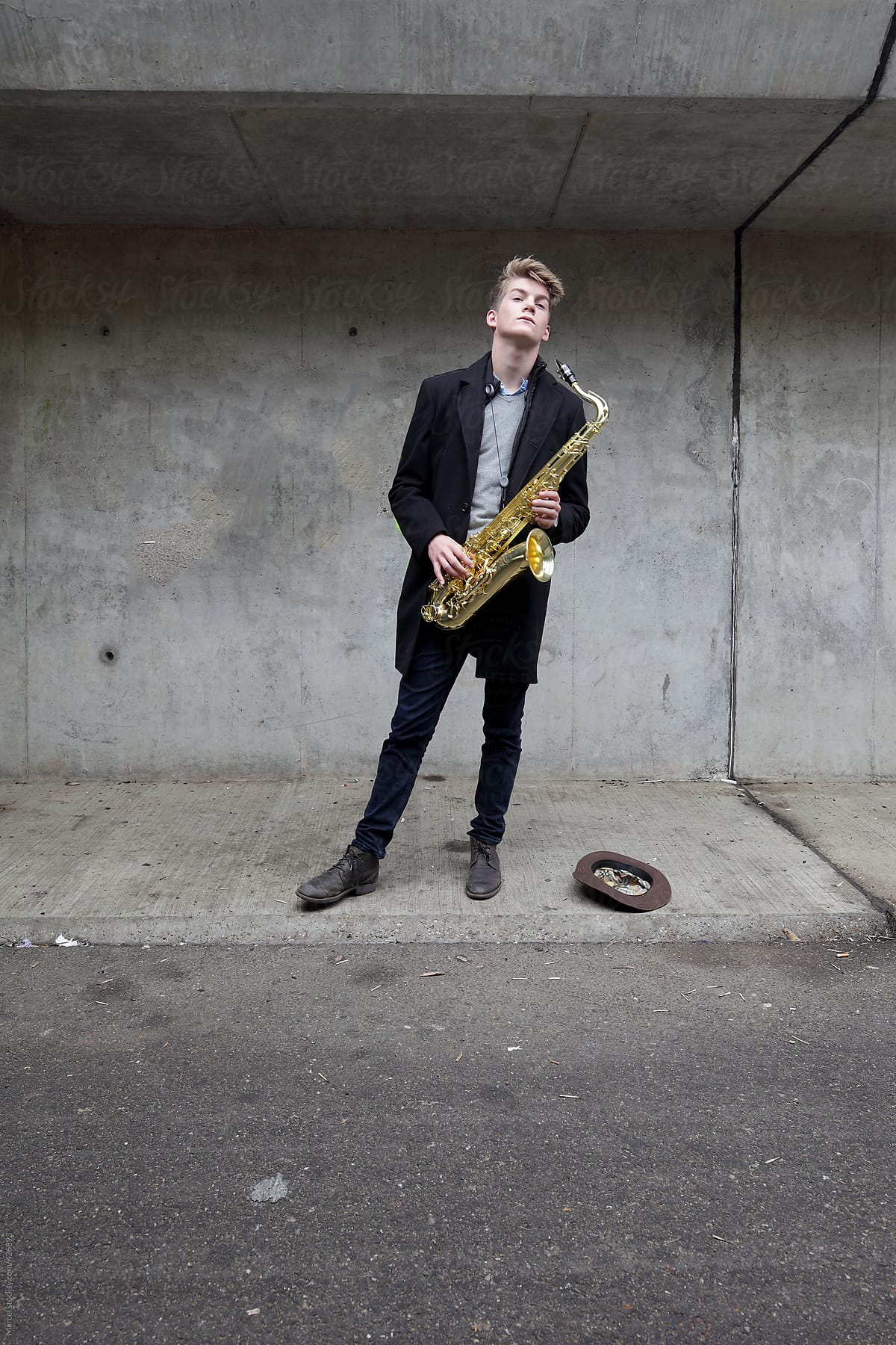 Saxophone player in urban tunnel