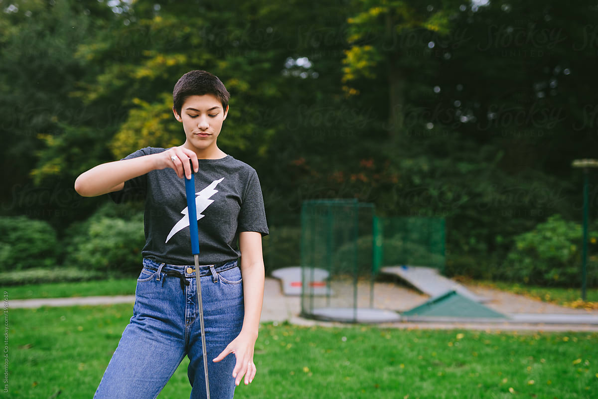 Woman with miniature golf club