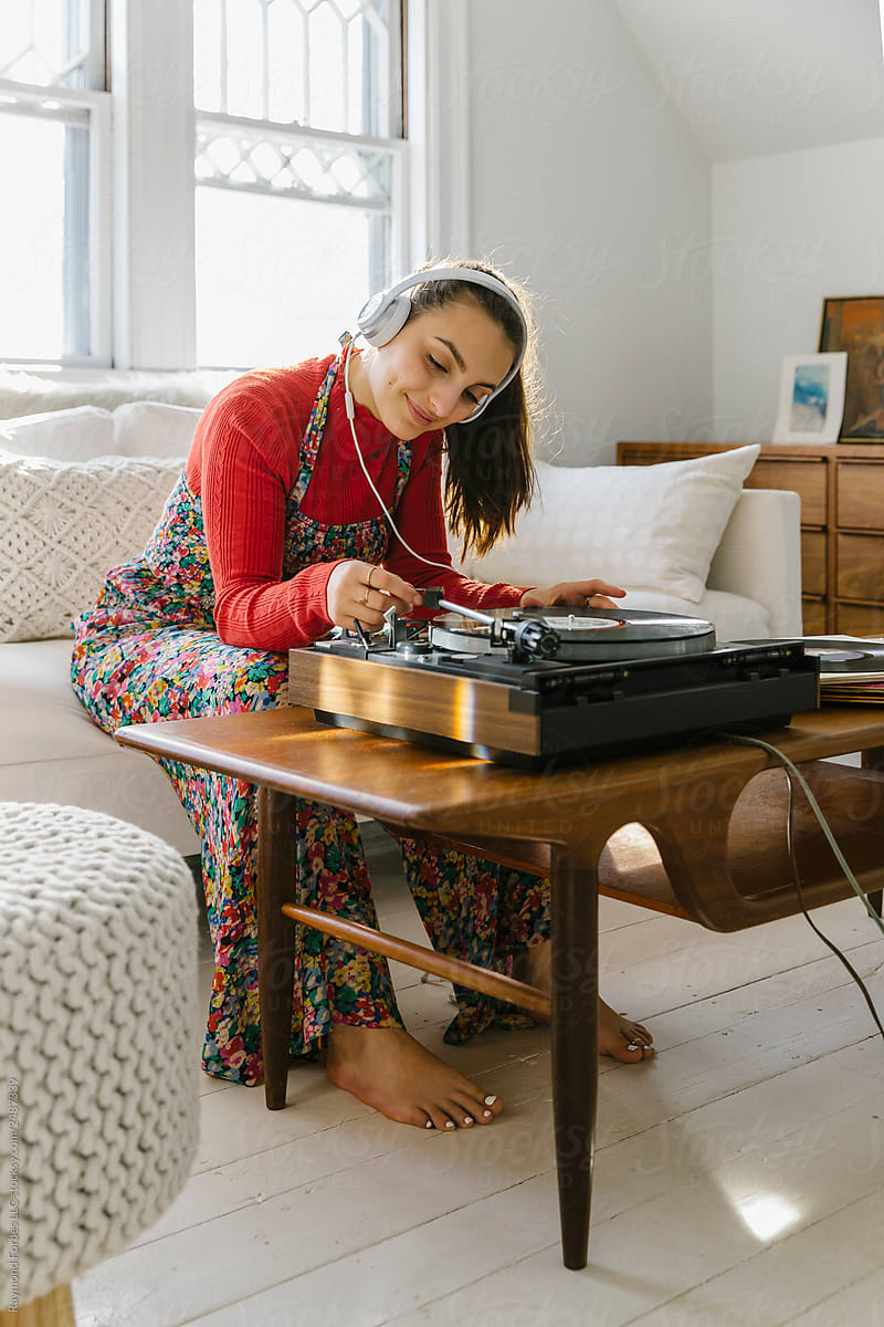 Teen Lifestyle image of Girl with Turntable listening to Music on Headphones