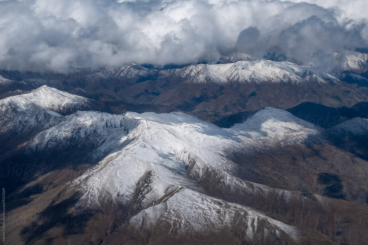 Aerial view of Mountain ranges with clouds in the background