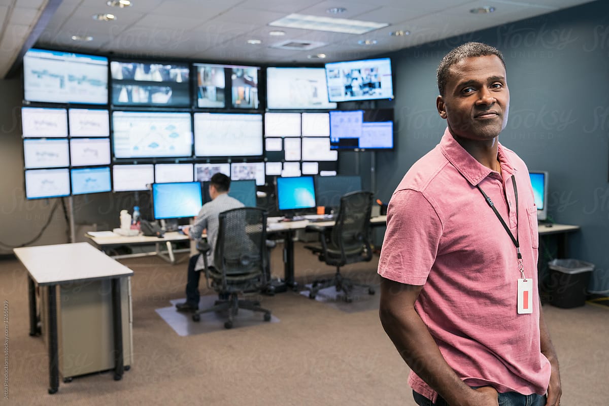 Portrait of a black technician in a server room monitoring cente