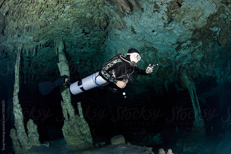 A scuba diver swimming in Mexico\'s  Cenote  Dos Ojos
