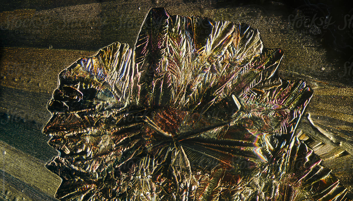 Golden crystal under microscope