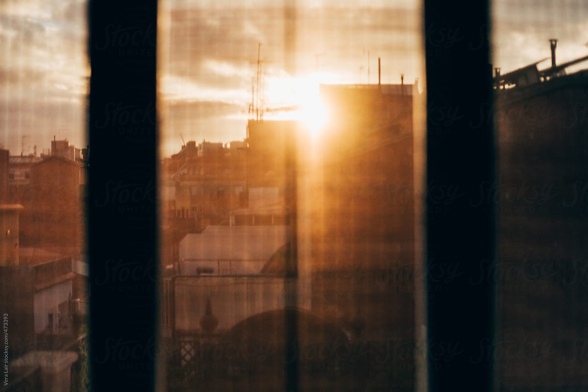 View of sunset behind a window