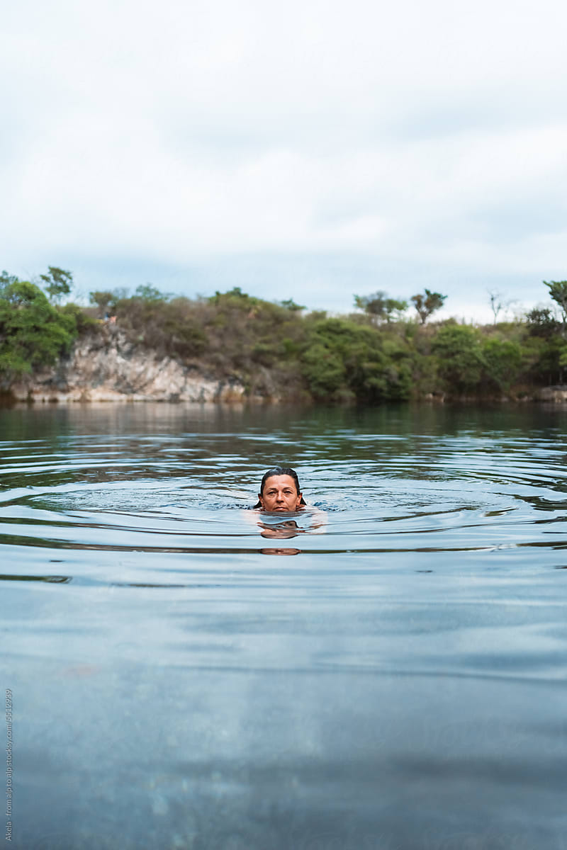 woman swimming in a cenote