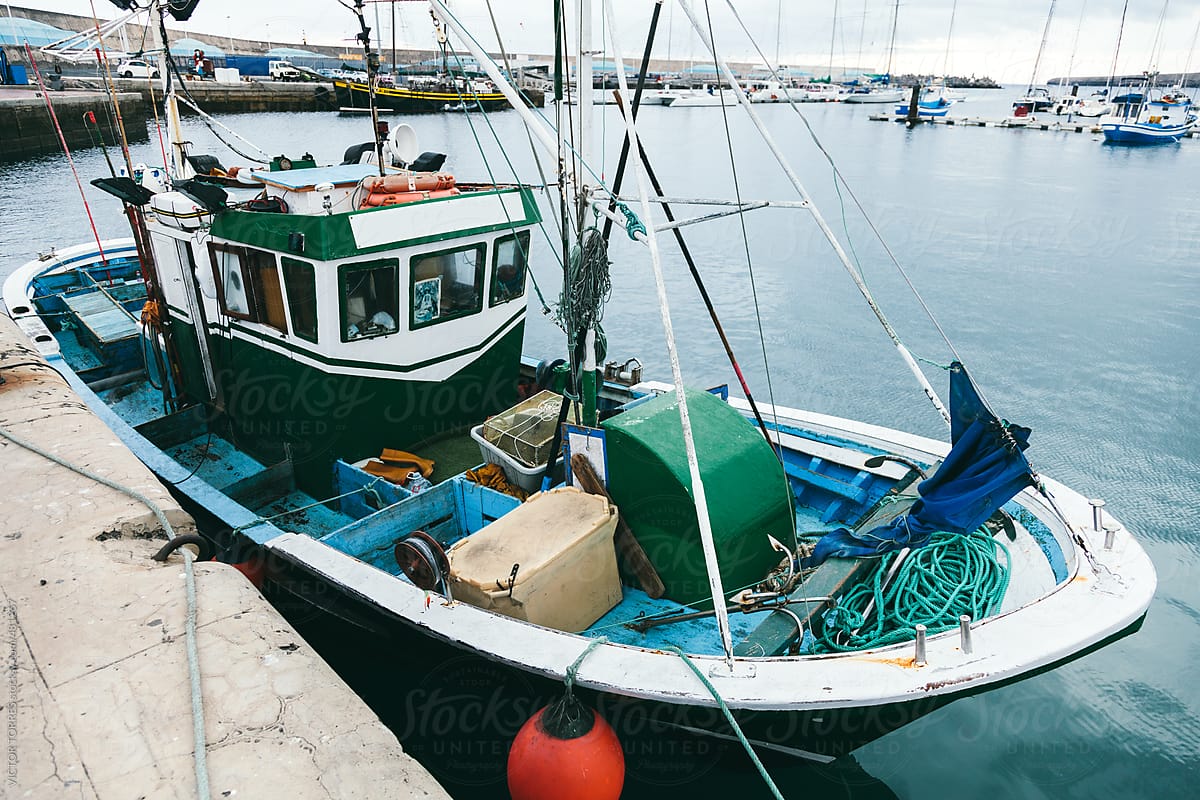 Old Fish Boat In Morro Jable Harbor, Fuerteventura by Stocksy Contributor  VICTOR TORRES - Stocksy