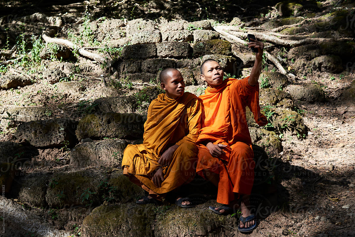 Two monks with cell phone