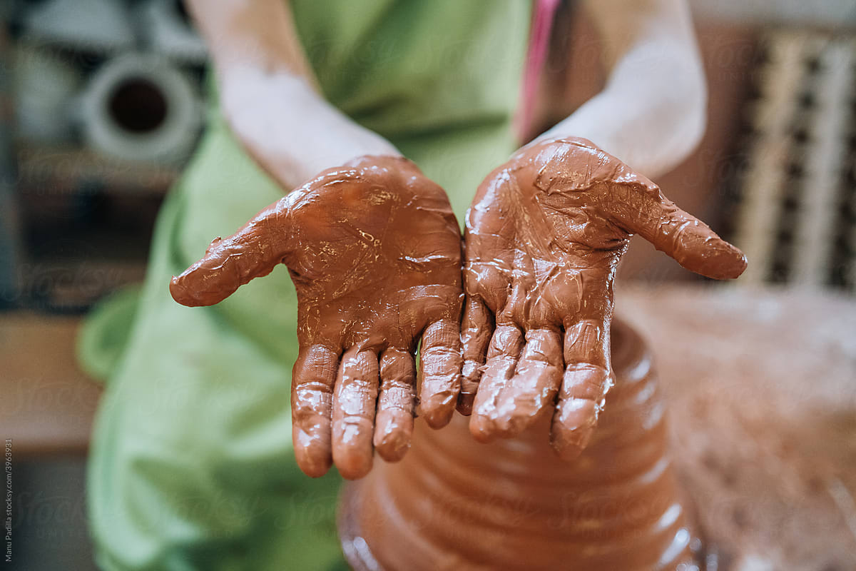 Woman Shows her Hands with Clay