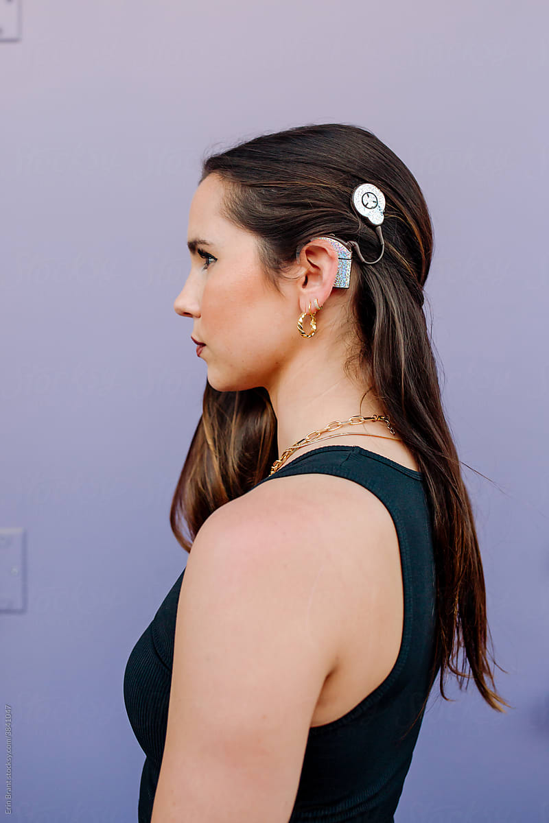 Young woman with cochlear implant skins