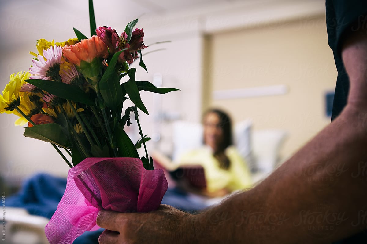 Hospital: Friend Brings Flowers To Patient