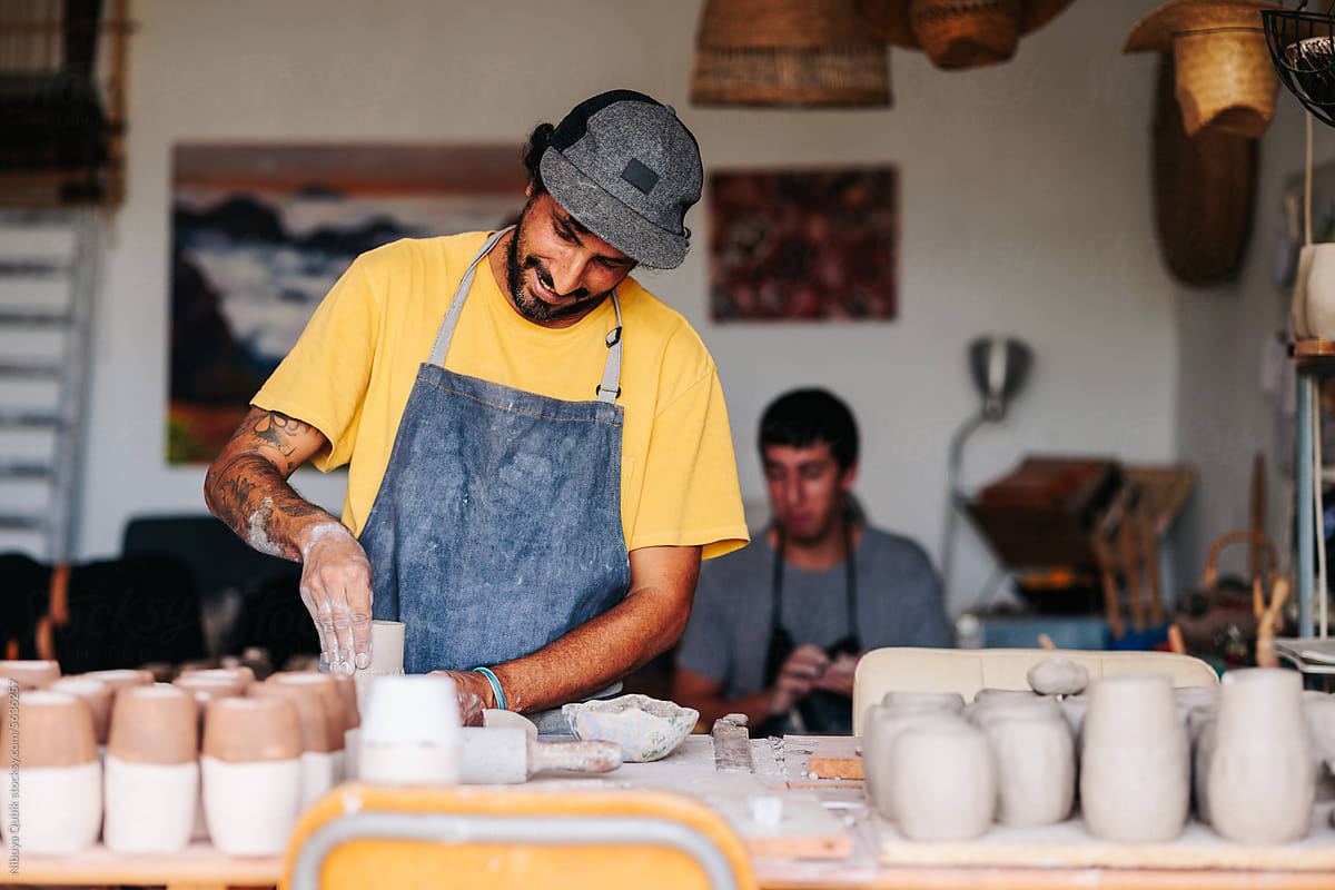 Experienced potters working in their ceramics studio