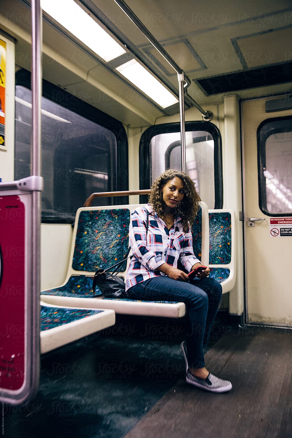 Adult Woman Riding The Subway By Stocksy Contributor Jayme Burrows