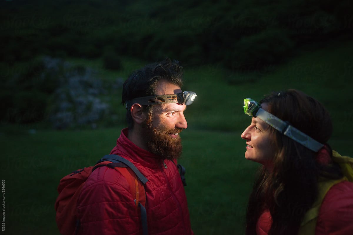 Couple of hikers looking at each other outdoor in nature