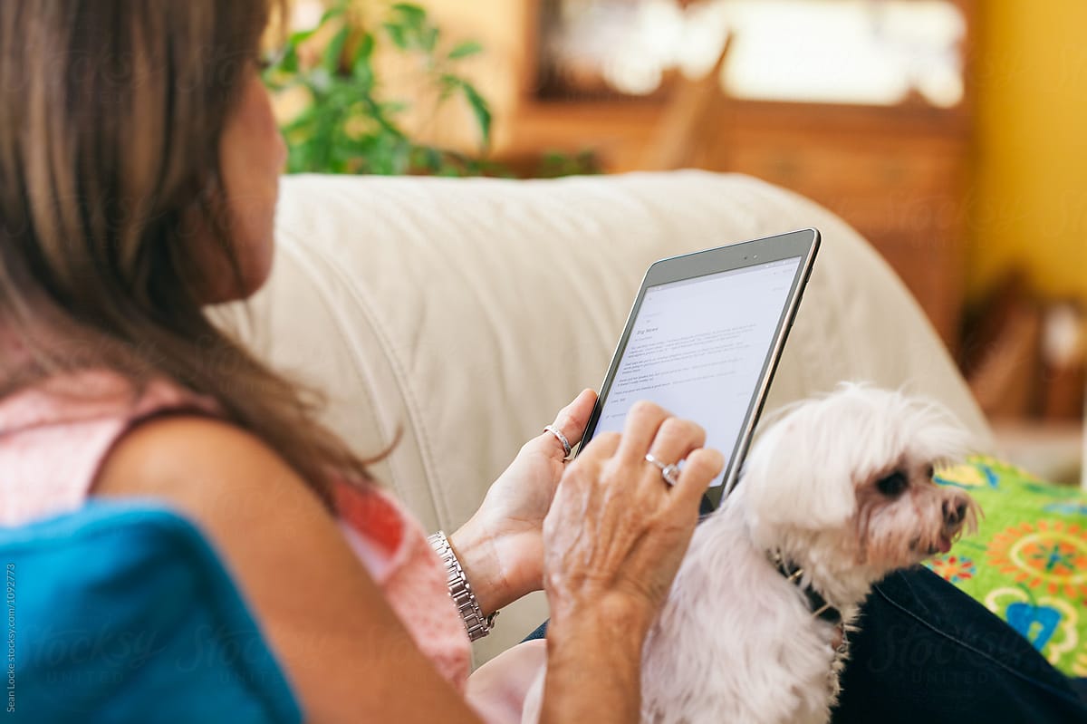Woman On Couch With Puppy Digital Tablet