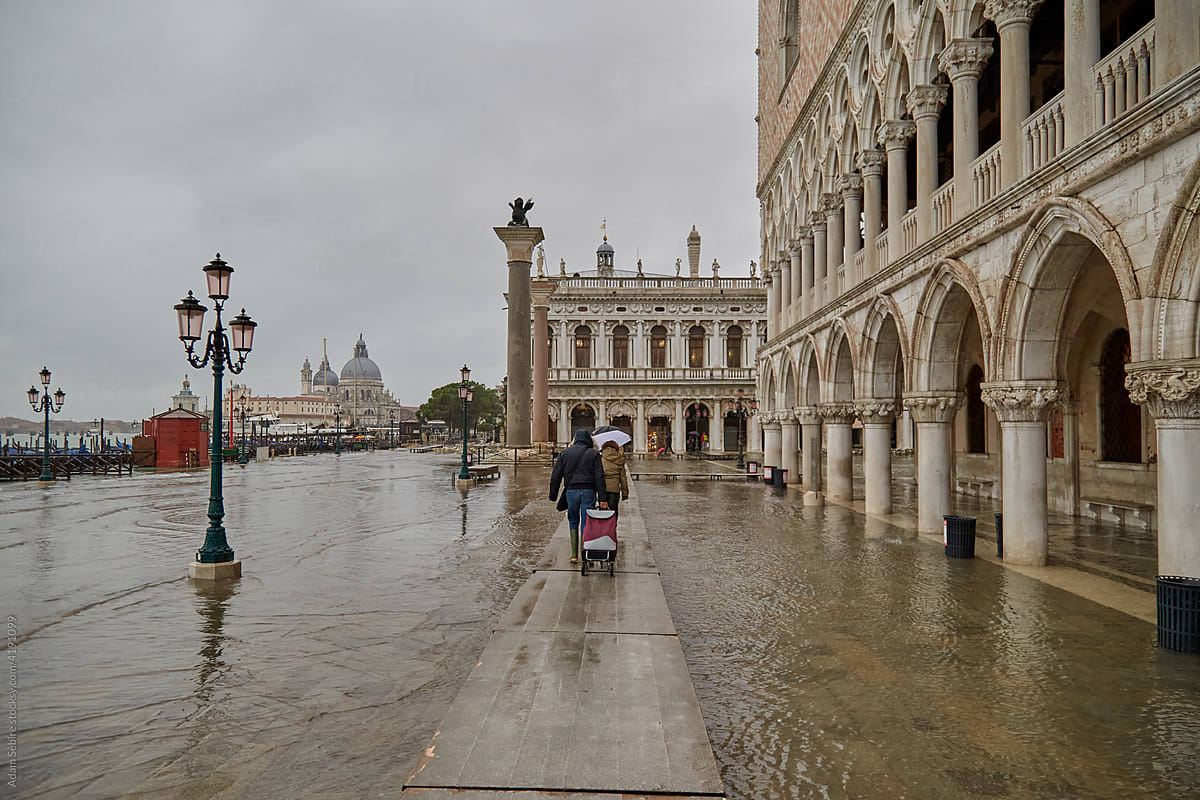 Flooding sea water and passerelle footpath in Venice