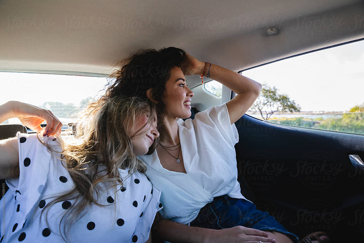 Happy women enjoying a car trip