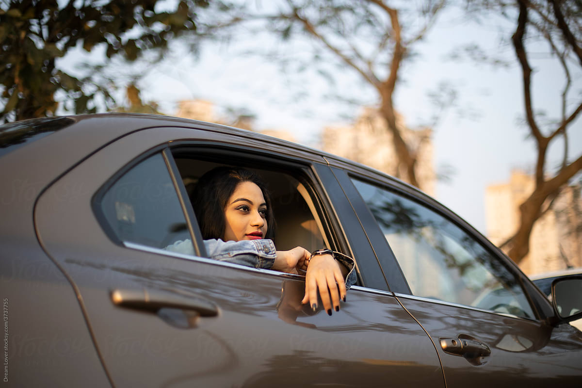 Indian woman inside car