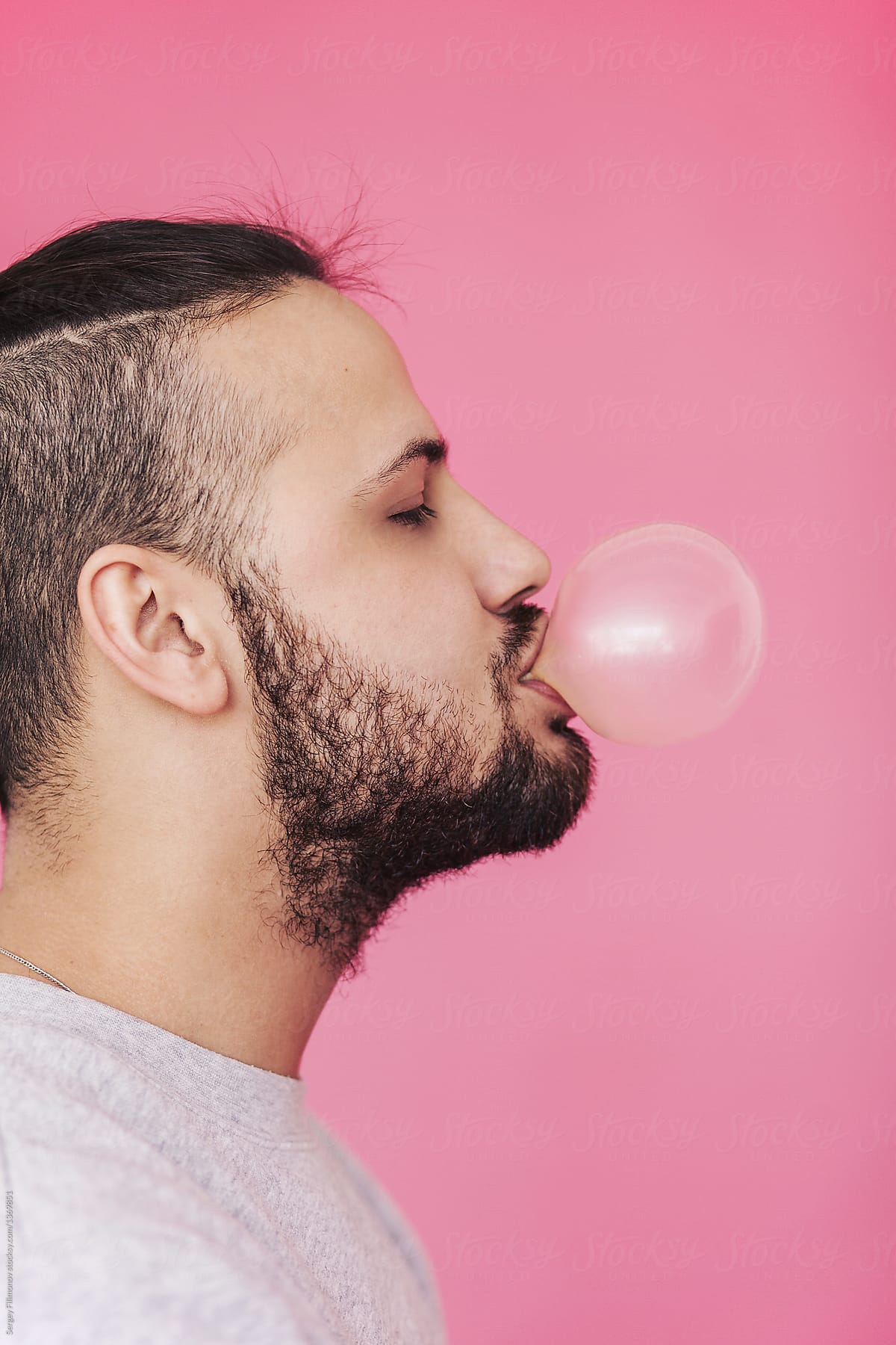 Charismatic Man Blowing Pink Bubble Gum By Sergey Filimonov