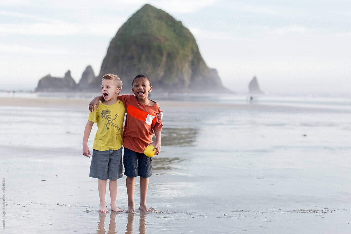 Brothers stand on Cannon Beach