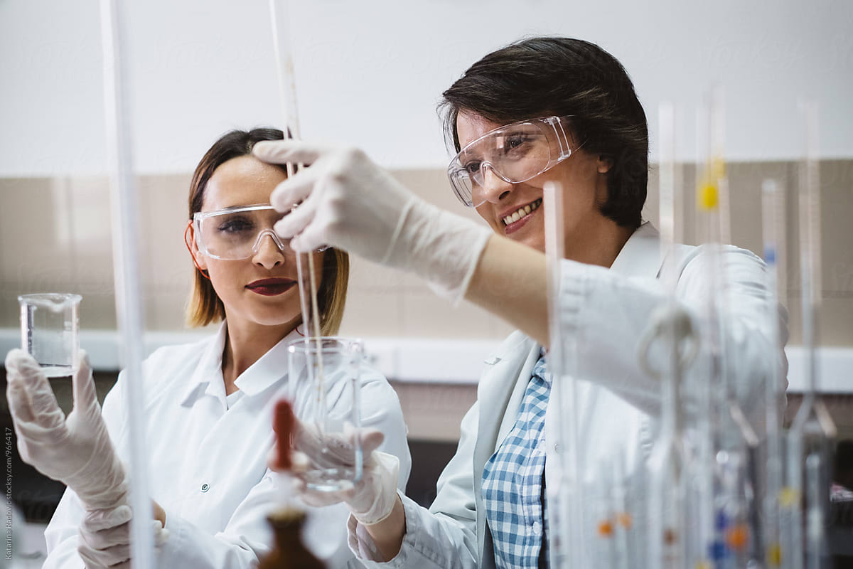 Two Female Chemist Scientists Working in the Lab