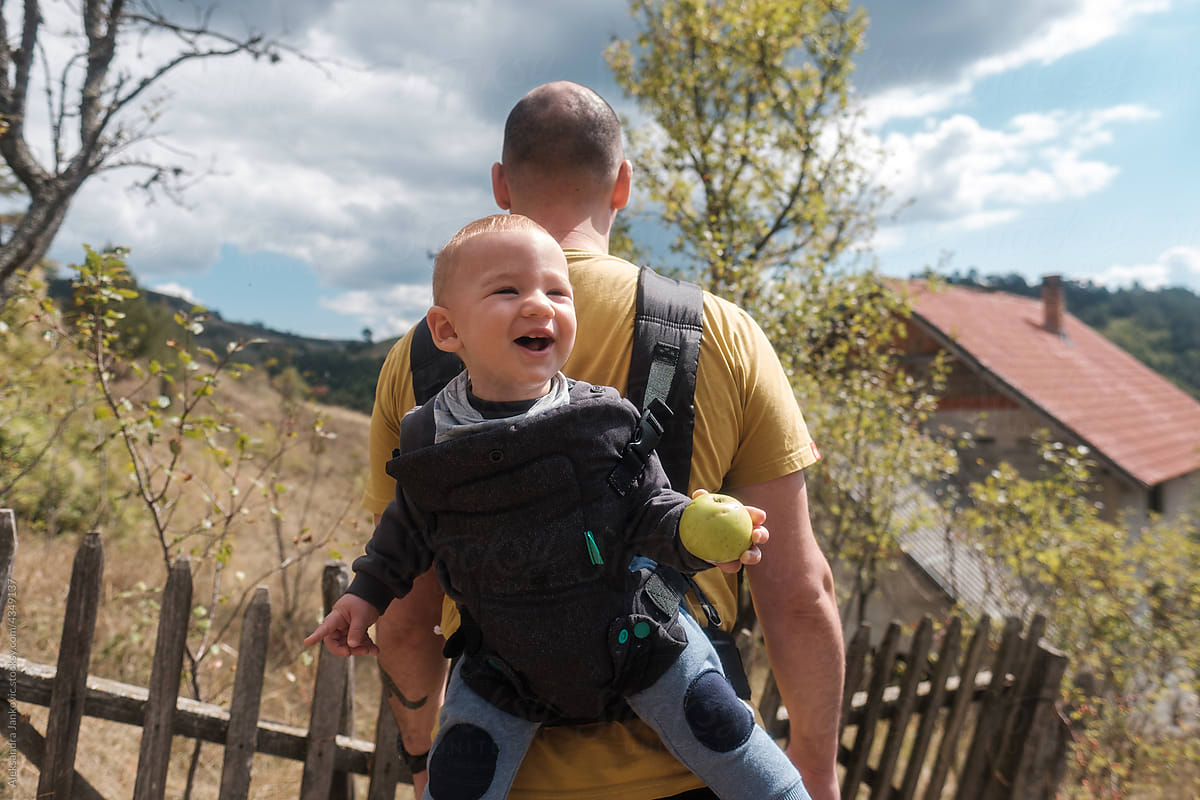 geur Advertentie Vertolking Anonymous Father With His Son In The Baby Carrier" by Stocksy Contributor  "Aleksandra Jankovic" - Stocksy