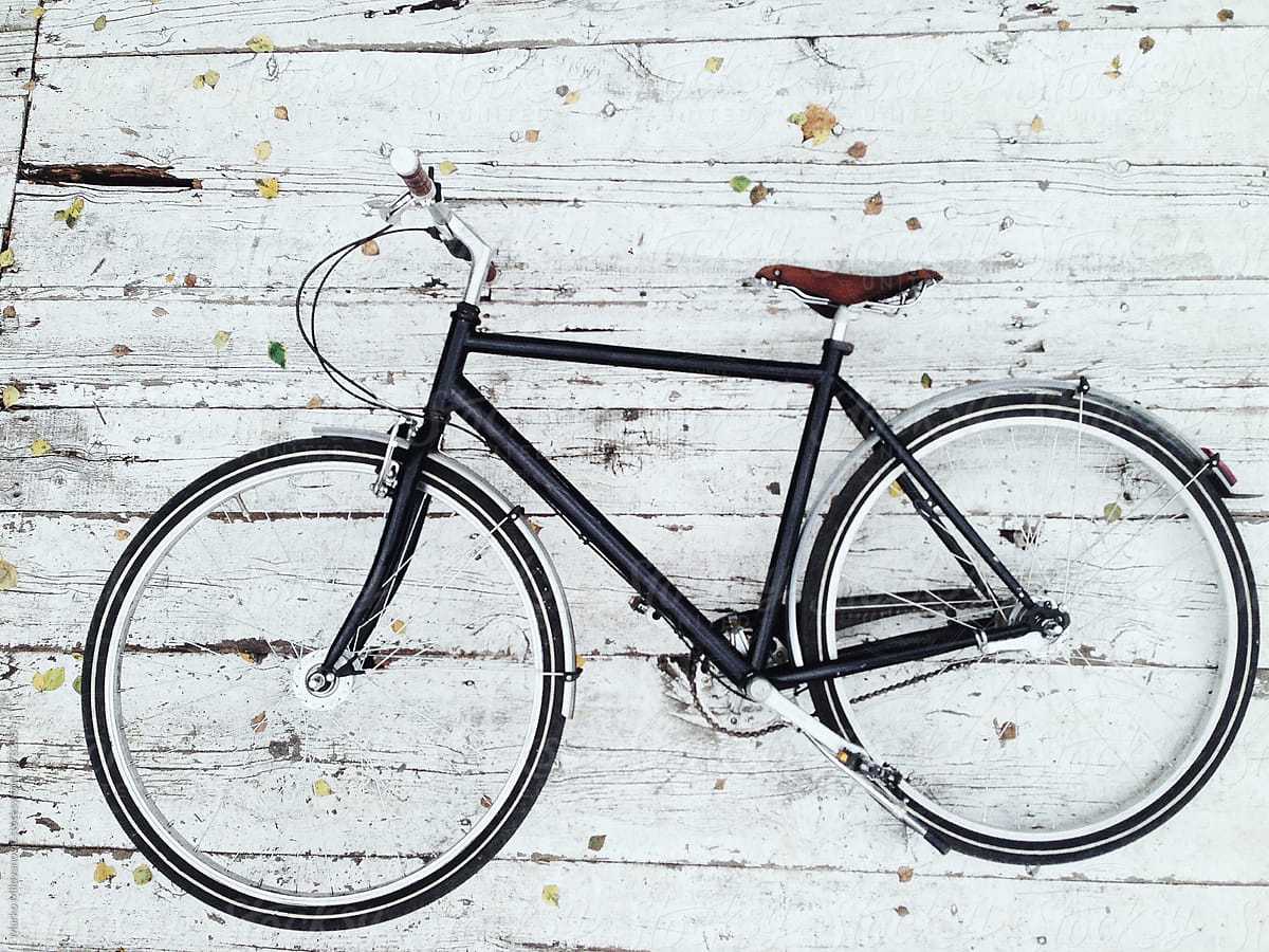Bicycle on the white background, wood