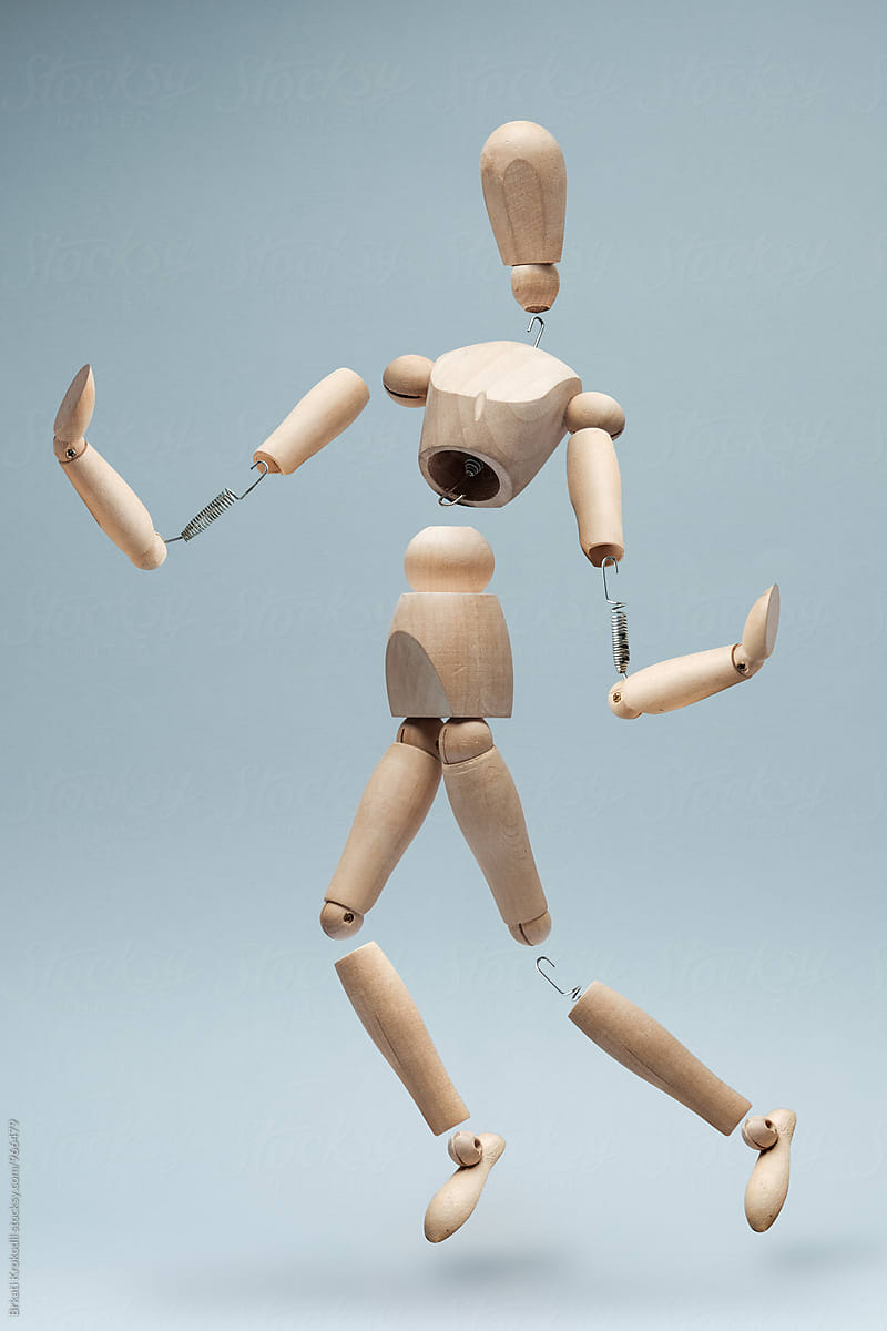 Deconstructed Wooden Model Doll On Grey Background