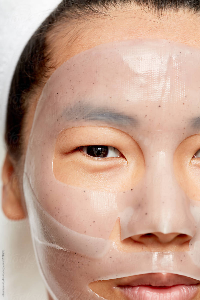 Young asian woman using facial gel mask