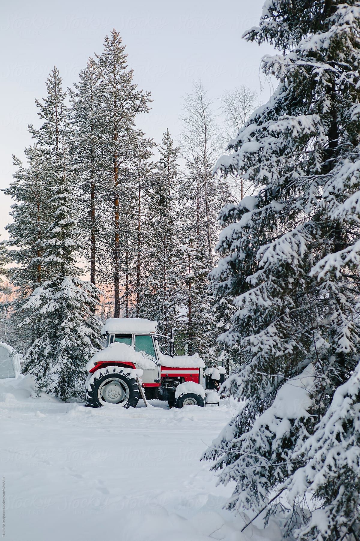 Tractor in snowy rural village