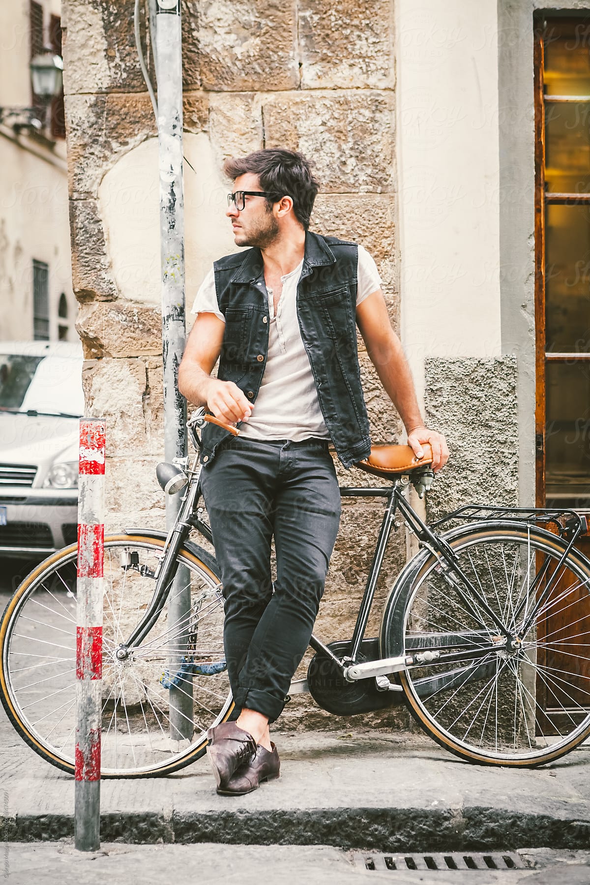 Trendy Tough Man with a Bicycle in an Italian Alley